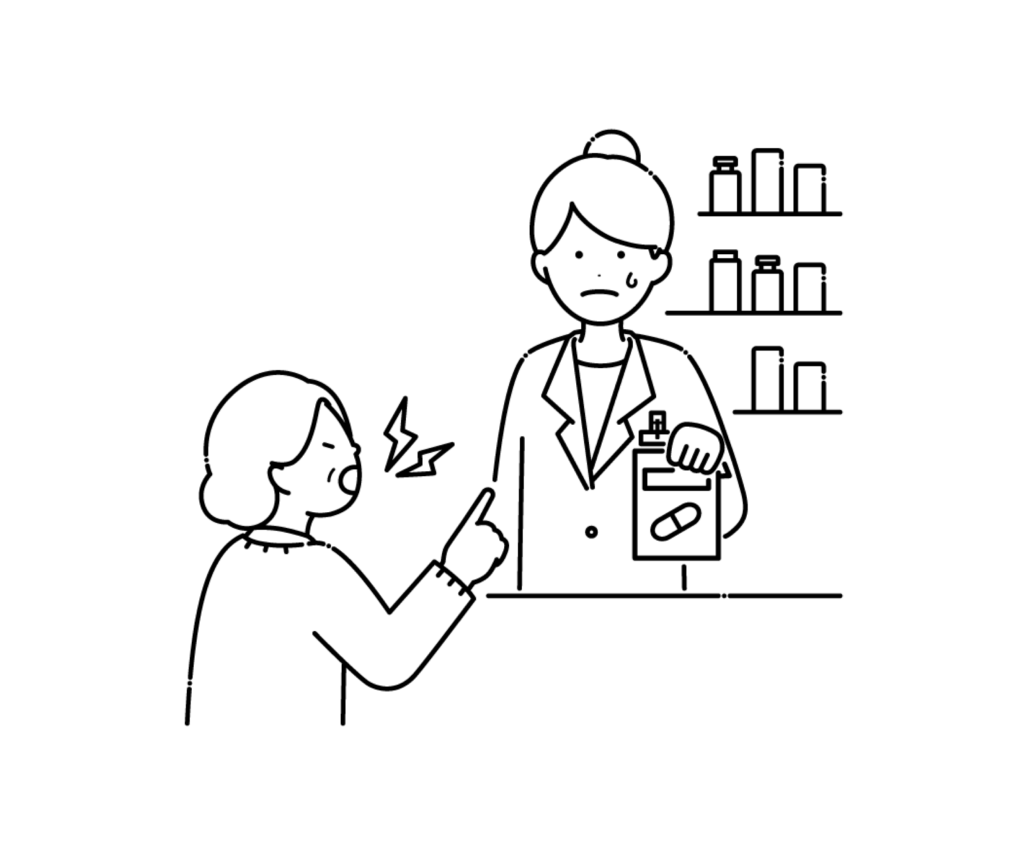 カスタマーハラスメントを受ける薬剤師の白黒イラスト